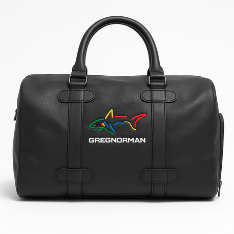 Black duffel bag with colorful shark logo and 'Greg Norman' text on a white background
