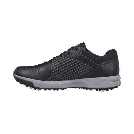 SkechersBlack golf shoe with a white sole on a white background